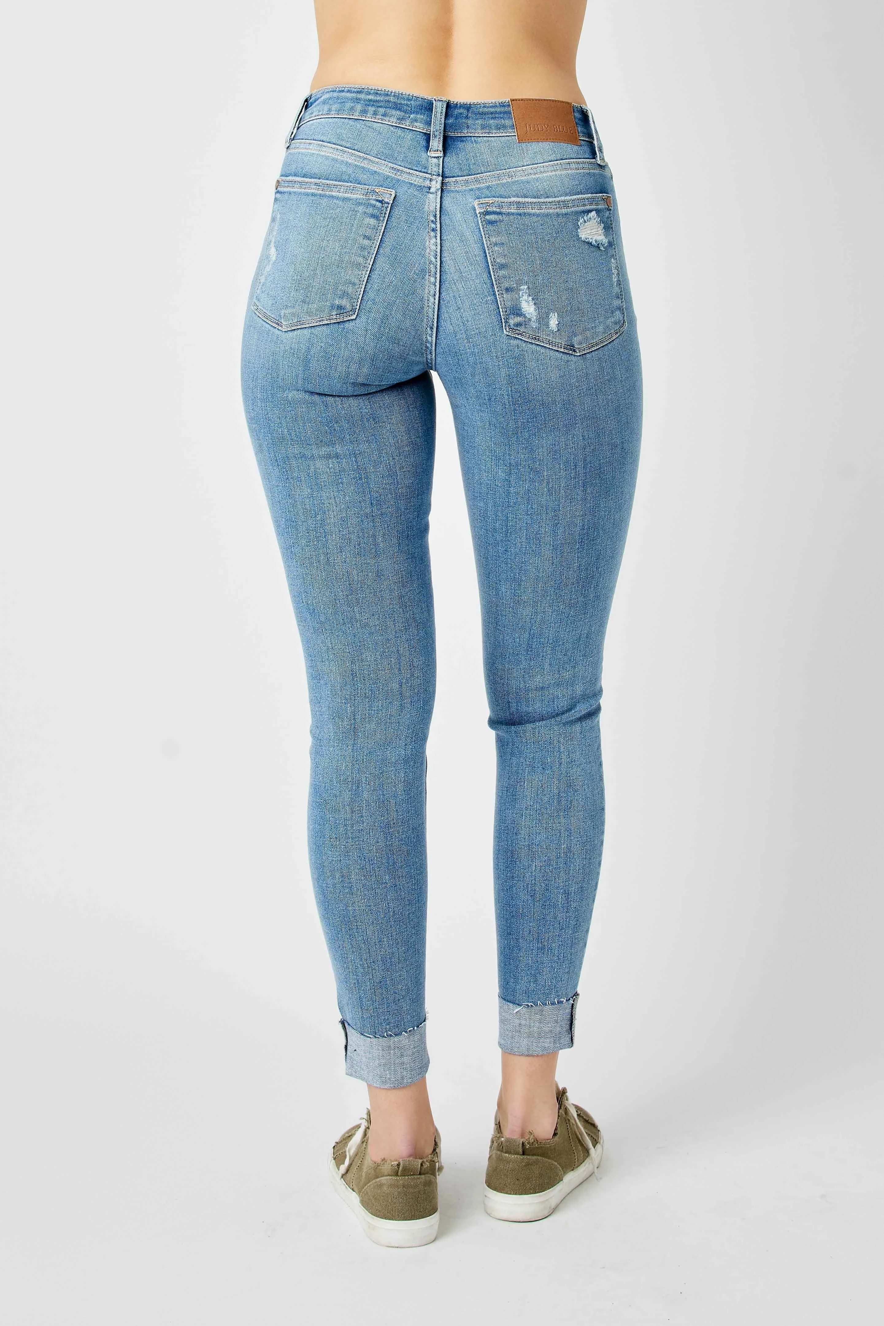 Judy Mid Rise Destroyed and Cuffed Skinny Denim Jeans in Medium Wash