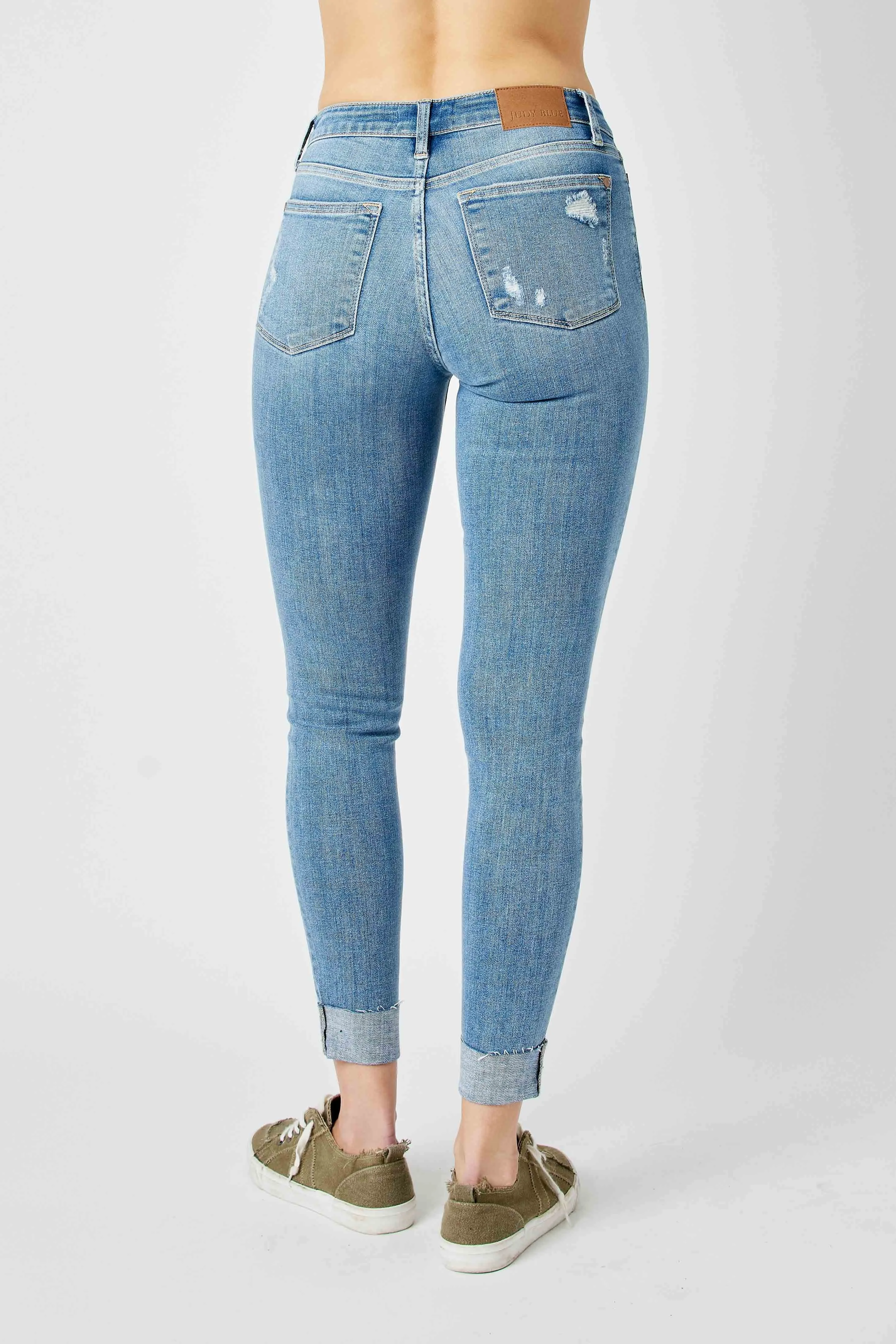 Judy Mid Rise Destroyed and Cuffed Skinny Denim Jeans in Medium Wash