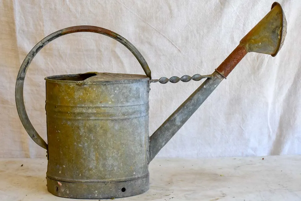 Vintage French zinc watering can with twisted brace